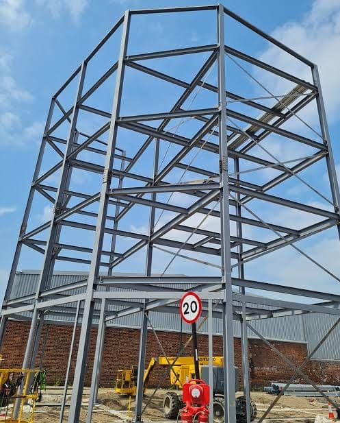 A braced steel frame tower on site.